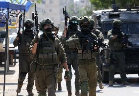 Israeli excavators demolish the houses in Hebron