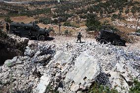Israeli excavators demolish the houses in Hebron