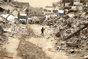 Palestinians Walking In A Sandstorm - Gaza