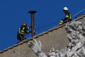 Firefighters Install Chimney On The Sistine Chapel For Papal Election - Vatican