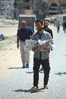 Palestinian Carry a Shrouded Body - Gaza
