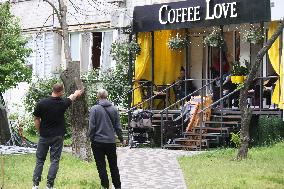 Shopping center, supermarket and residential building damaged by shelling in Kyiv
