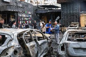 Shopping center, supermarket and residential building damaged by shelling in Kyiv
