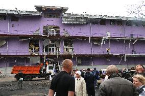 Shopping center, supermarket and residential building damaged by shelling in Kyiv