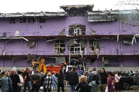 Shopping center, supermarket and residential building damaged by shelling in Kyiv