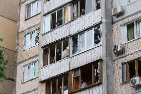 Shopping center, supermarket and residential building damaged by shelling in Kyiv