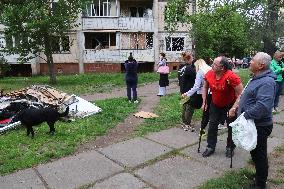 Shopping center, supermarket and residential building damaged by shelling in Kyiv