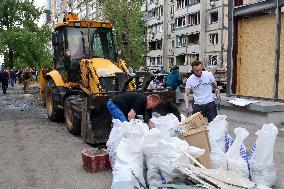 Shopping center, supermarket and residential building damaged by shelling in Kyiv