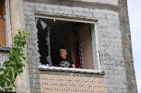 Shopping center, supermarket and residential building damaged by shelling in Kyiv