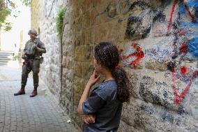 Israeli Forces Escort Settlers - Hebron