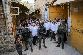 Israeli Forces Escort Settlers - Hebron