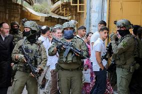 Israeli Forces Escort Settlers - Hebron
