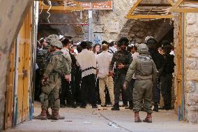 Israeli Forces Escort Settlers - Hebron