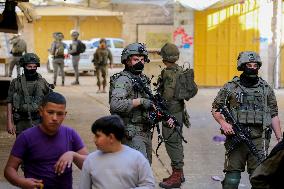 Israeli Forces Escort Settlers - Hebron