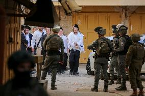 Israeli Forces Escort Settlers - Hebron