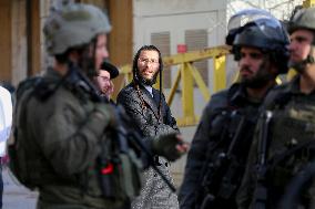 Israeli Forces Escort Settlers - Hebron