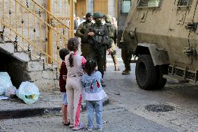 Israeli Forces Escort Settlers - Hebron