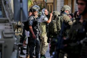 Israeli Forces Escort Settlers - Hebron