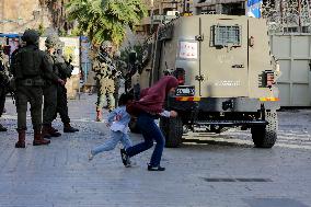 Israeli Forces Escort Settlers - Hebron