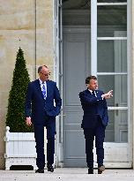 Macron and Merz Discuss in Elysee Garden - Paris