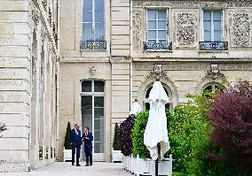 Macron and Merz Discuss in Elysee Garden - Paris