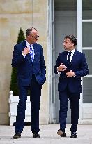 Macron and Merz Discuss in Elysee Garden - Paris