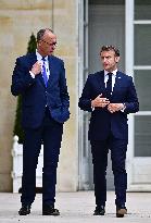 Macron and Merz Discuss in Elysee Garden - Paris