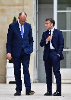 Macron and Merz Discuss in Elysee Garden - Paris