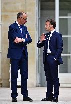 Macron and Merz Discuss in Elysee Garden - Paris