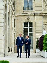 Macron and Merz Discuss in Elysee Garden - Paris