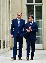 Macron and Merz Discuss in Elysee Garden - Paris