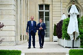Macron and Merz Discuss in Elysee Garden - Paris