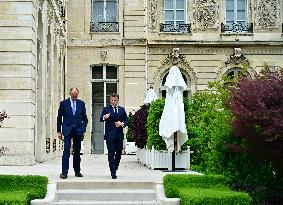 Macron and Merz Discuss in Elysee Garden - Paris