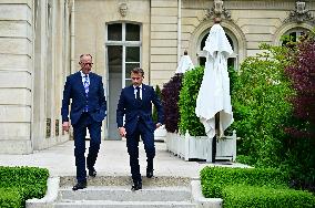 Macron and Merz Discuss in Elysee Garden - Paris