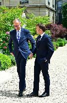 Macron and Merz Discuss in Elysee Garden - Paris