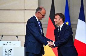 Macron and Merz Hold Joint Press Conference at Elysee - Paris
