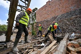 Building damaged by Russian attack gets dismantled in Lviv