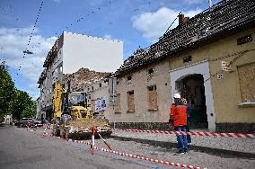 Building damaged by Russian attack gets dismantled in Lviv