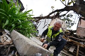 Building damaged by Russian attack gets dismantled in Lviv