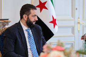 Ahmed Al-Sharaa Meets Syrian Photographer Known as Caesar - Paris