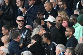 DJ Snake, Omar Sy And Tony Parker At PSG v Arsenal - Paris