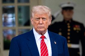 President Donald Trump Speaks with Reporters Outside Oval