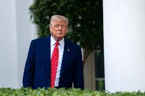 President Donald Trump Speaks with Reporters Outside Oval