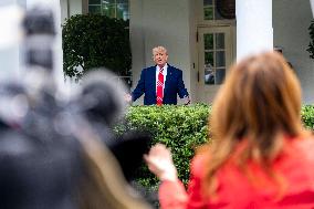 President Donald Trump Speaks with Reporters Outside Oval