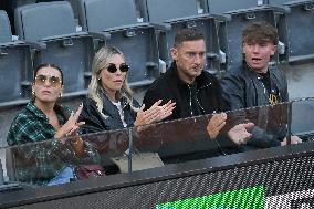 Francesco Totti with his partner Noemi Bocchi and his children Chanel and Cristian