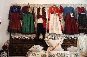 Collection of old Bulgarian towels, clothes and jewelry in Krynychne village