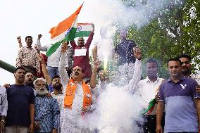 Supporters Wave Flag In Support Of Missile Strikes - India