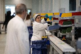 President Macron Visits EssilorLuxottica Laboratory - Wissous