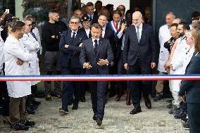 President Macron Visits EssilorLuxottica Laboratory - Wissous