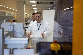 President Macron Visits EssilorLuxottica Laboratory - Wissous